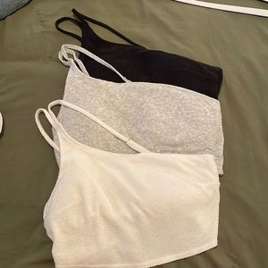 three hollister one shoulder lounge bralettes
